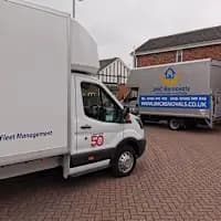 JMC Removals fleet of vans in Warrington — removal company