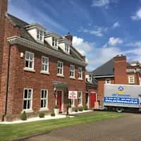 JMC Removals van at a large house in Cheshire — professional removal service