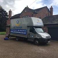 JMC Removals team packing and loading van in Warrington